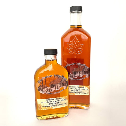 Two glass bottles of Pure Quebec Maple syrup

